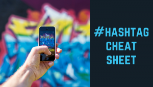 Hand holding cell phone with header "Hashtag Cheat Sheet"